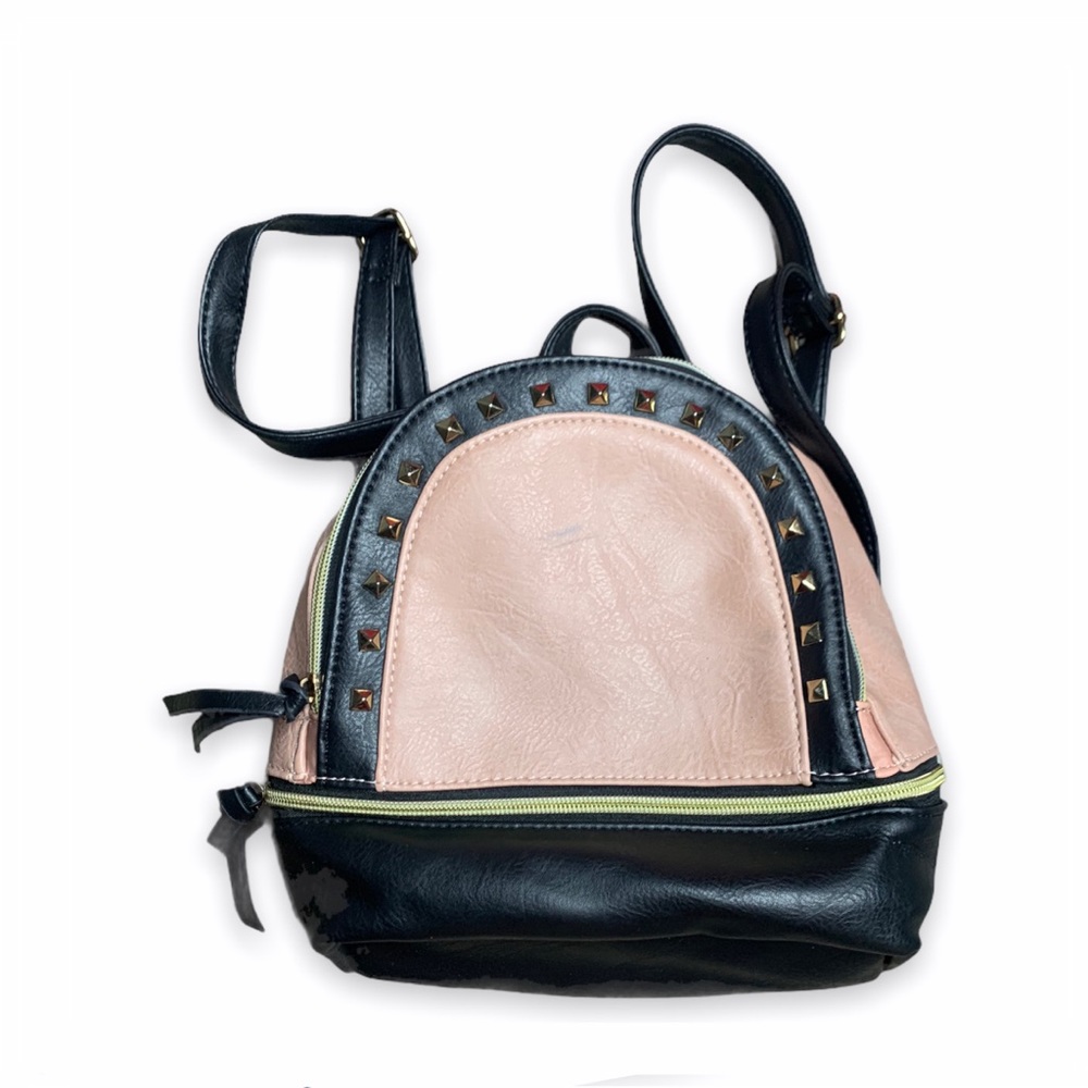 Pink studded mini backpack.
